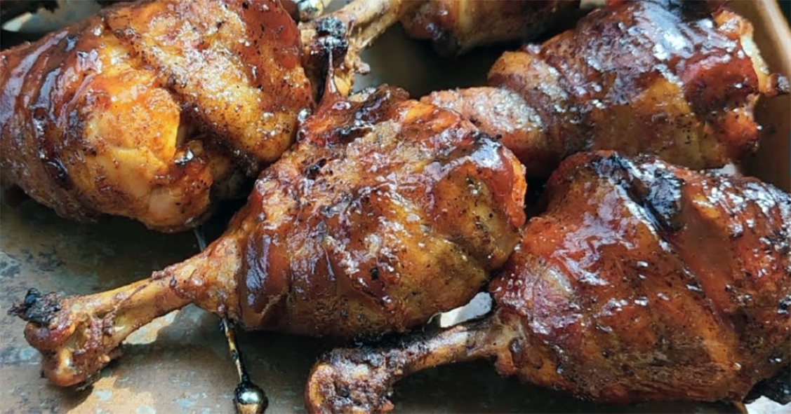barbecued thyme bomb chicken drumsticks on baking parchment