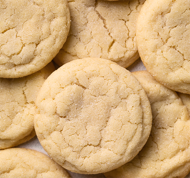 traditional sugar cookies piled on a plate