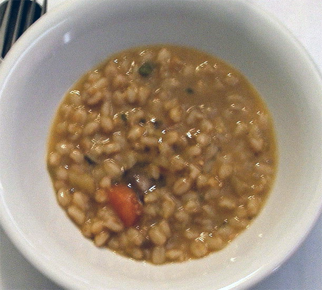 Tuscan farro, vegetable and bean soup in a soup bowl