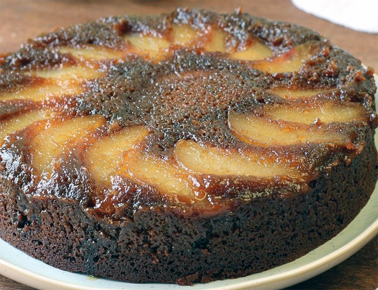 upside-down pear gingerbread cake on a plate