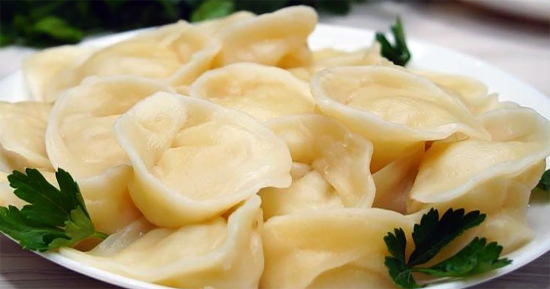 vushka dumplings and parsley leaves on a plate