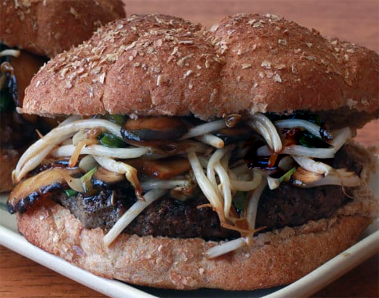  beef burger topped with bean sprouts