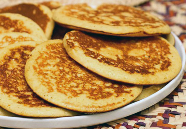 Atayef lebanese pancakes shown overlapping on a plate