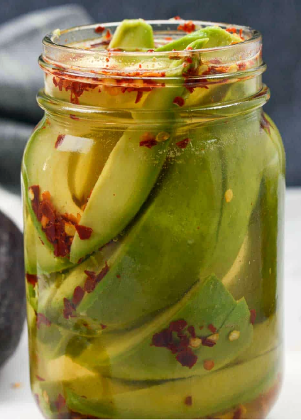 quick pickle of under-ripe avocado with chillies flavoured with avocado leaf