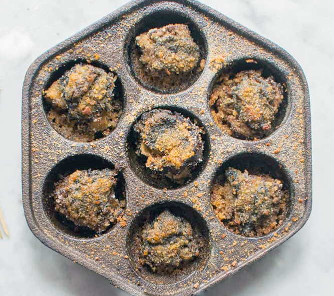 morel mushrooms baked in herbed garlic butter with a breadcrumb topping in a cast iron aebelskiver