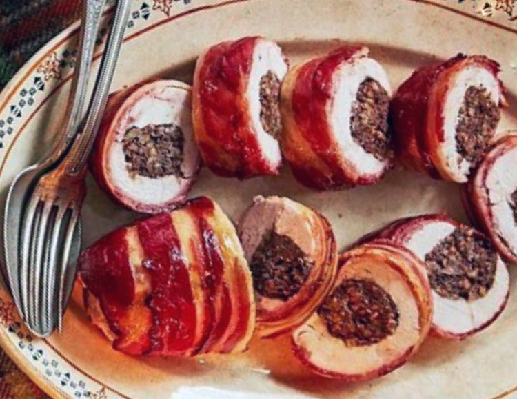 balmoral chicken, chicken stuffed with haggis and wrapped in bacon shown sliced on a serving plate