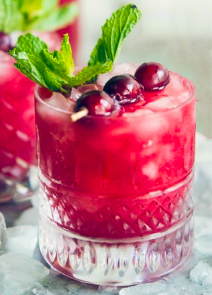 berry agua fresca served at a virgin cocktail with water and a dash of pickle juice in a tumbler with fruit and mint garnish