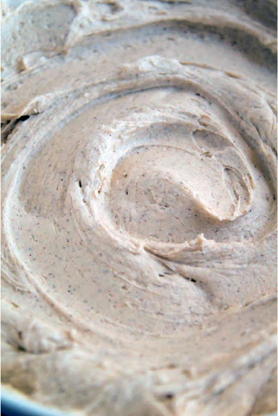 cinnamon buttercream icing swirled in a bowl