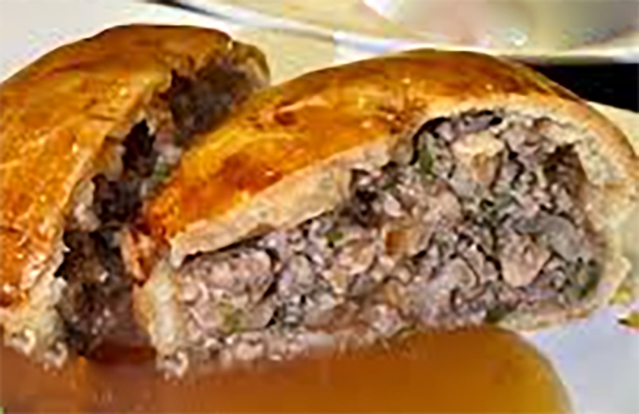 Francatelli Windsor mutton pie split in half and served with gravy