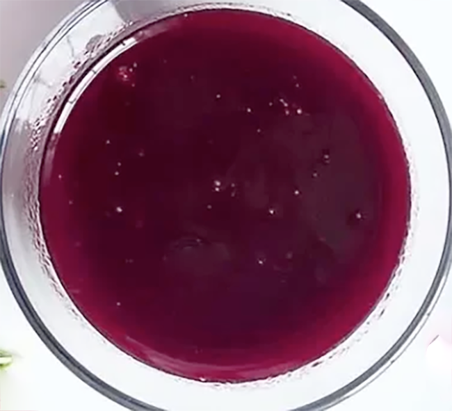 Raspberry and redcurrant dessert sauce in a glass bowl