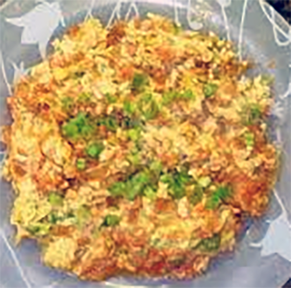Armenian avgitov Kufta, scrambled eggs with bulgur wheat and tomatoes on a plate