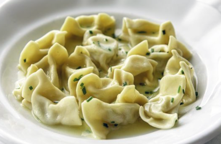 Idrijski žlikrofi slovenian potato and bacon dumplings served in a bowl