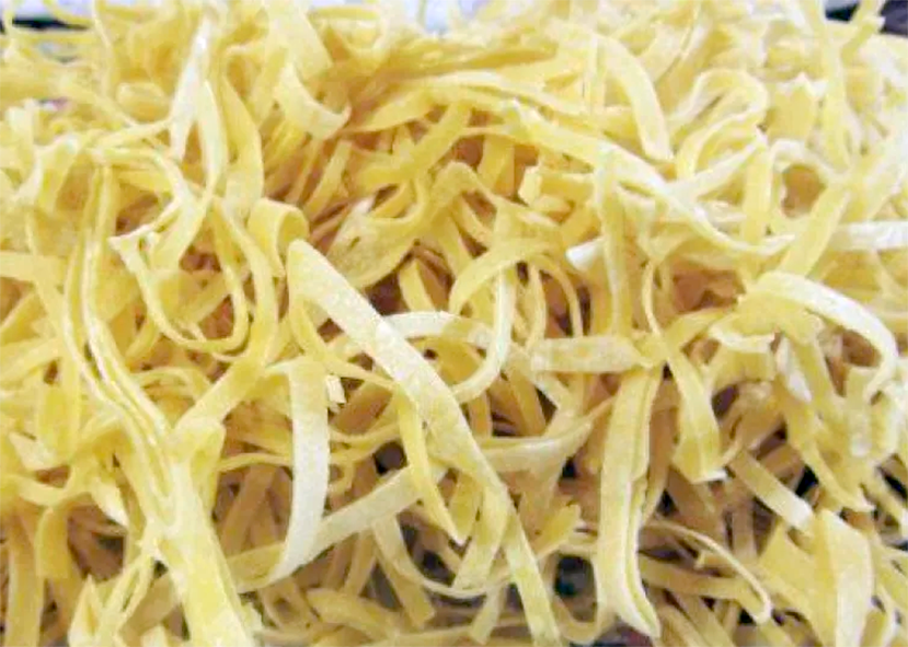 Pile of semi-dried home-made egg noodles