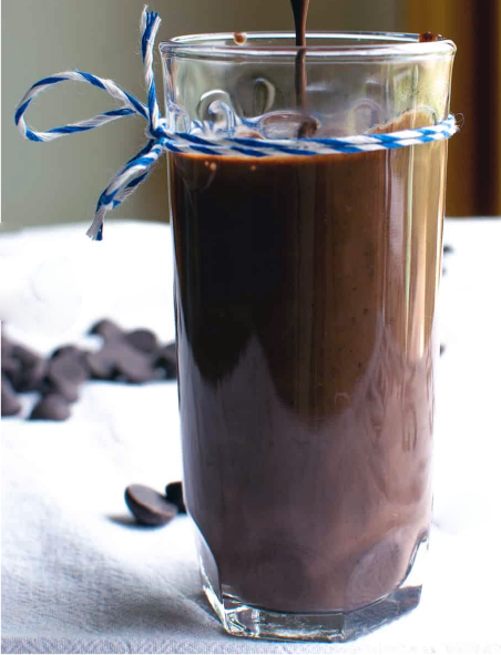 Mexican chocolate sauce in a glass decorated with a string bow