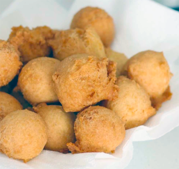 fried cake batter Nigerian buns on a plate lined with a napkin