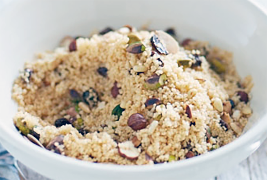 nutty moroccan couscous served in a white bowl