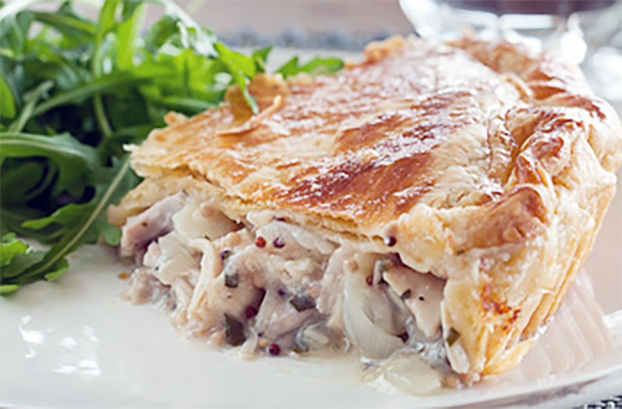 chicken and mustard pie served with rocket leaves