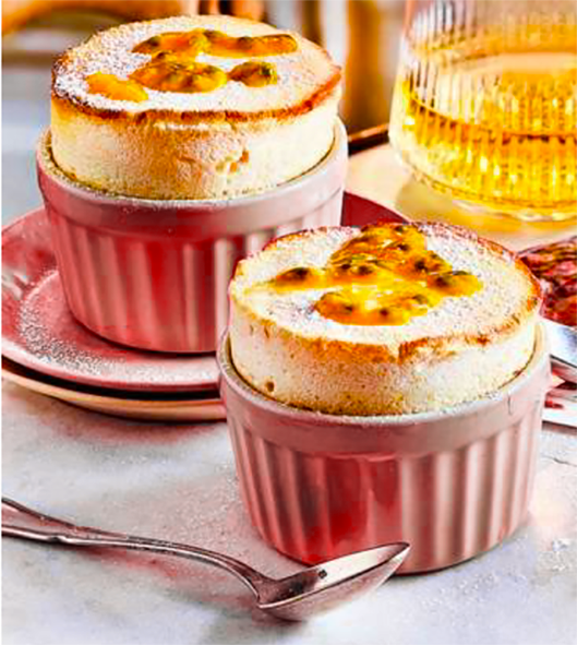 two passion fruit souffles on a table