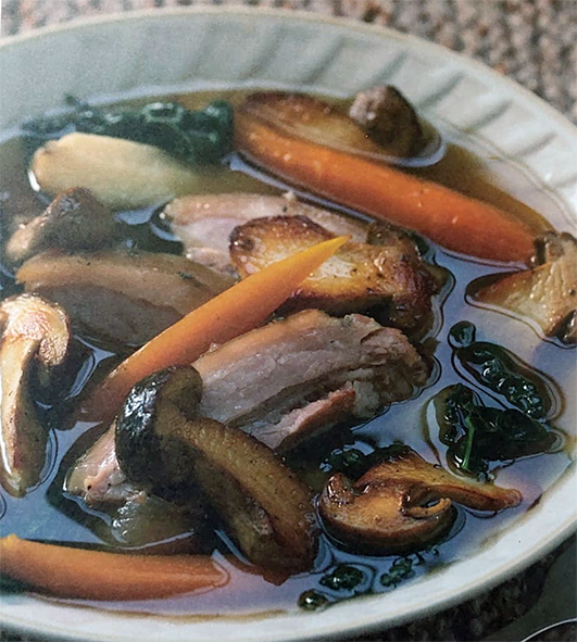 stew of winter root vegetables and cep mushrooms in a white bowl