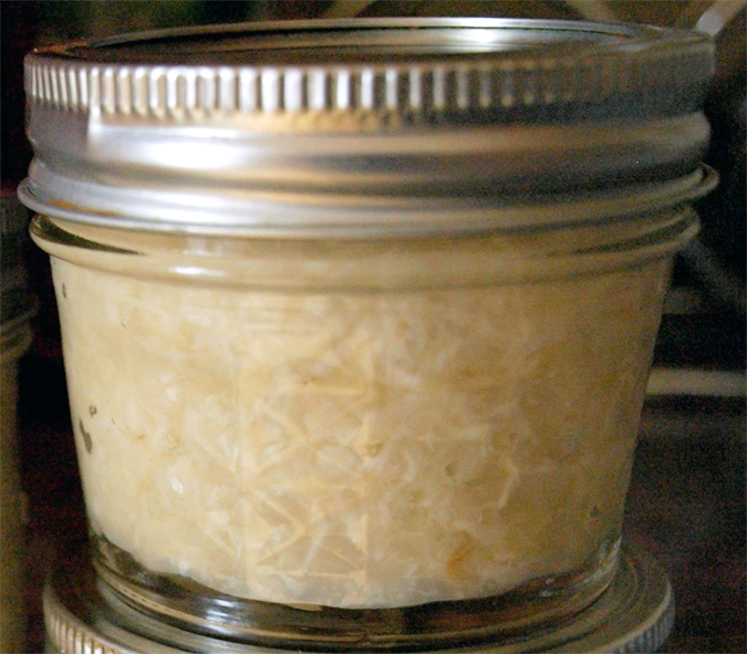 pickled grated horseradish in a small, sealed, jar