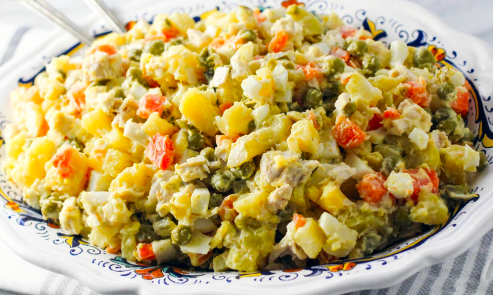 Salad olivye, Russian potato salad piled in a serving dish