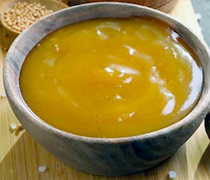 sauce au miel, honey sauce presented in a wooden bowl