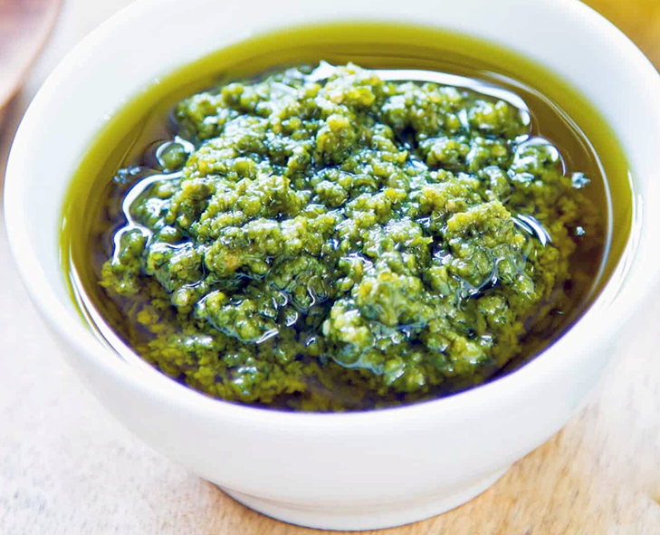 Italian sauce verde or green sauce in a small white bowl
