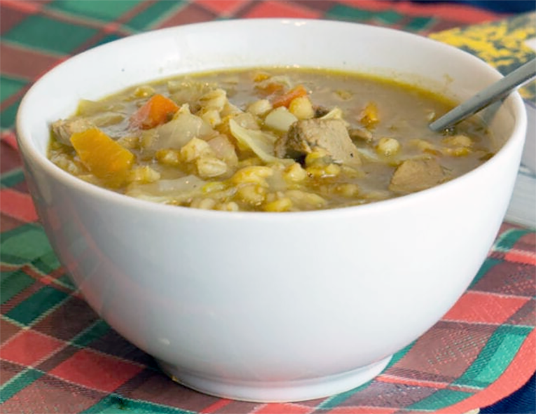 scotch broth soup presented in a white bowl