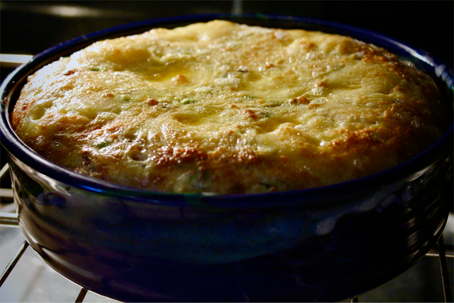 soufflé flan of st georges mushrooms in a ceramic dish in the oven