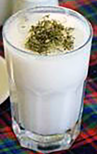 ayran garnished with shredded mint served in a glass