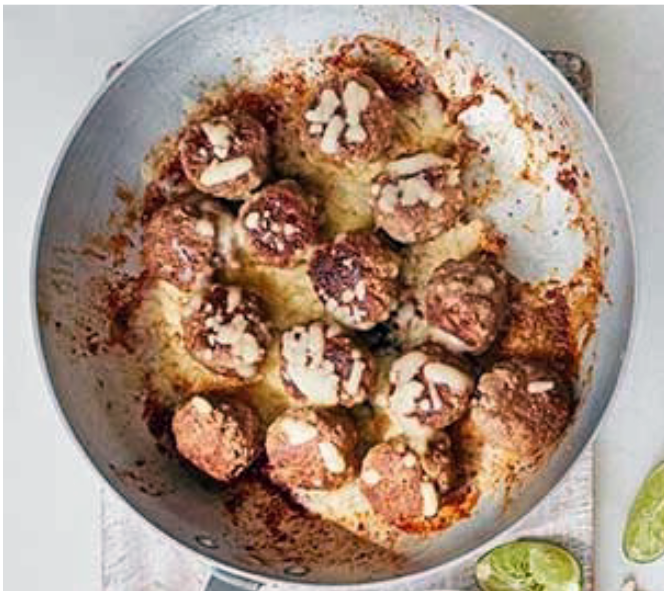 Tex-Mex meatballs cooking in a frying pan