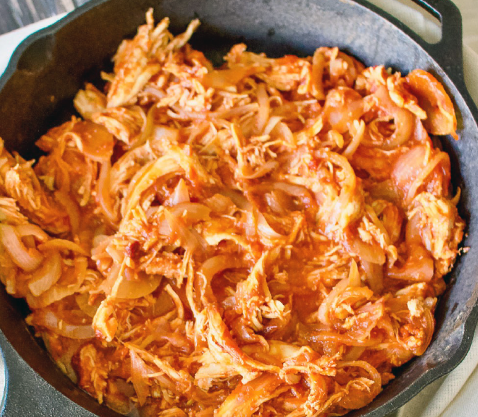 tinga de pollo in a cast iron skillet