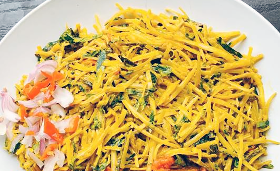 Abacha Ncha, Dried Cassava with Garden Eggs salad presented on a white plate