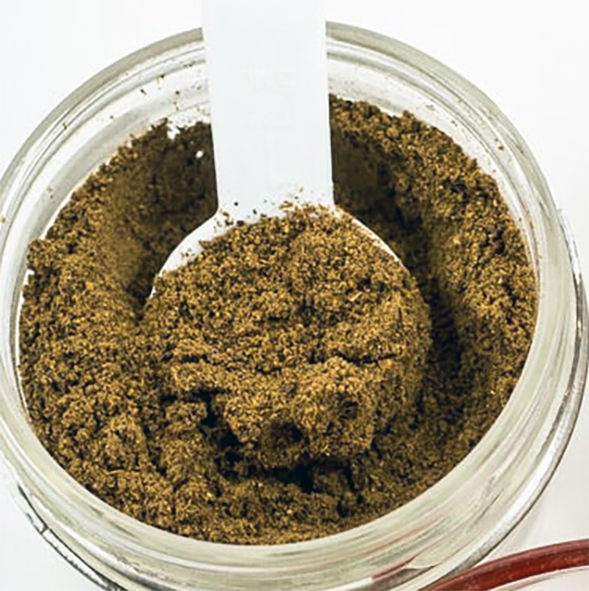achu spice blend in a glass jar