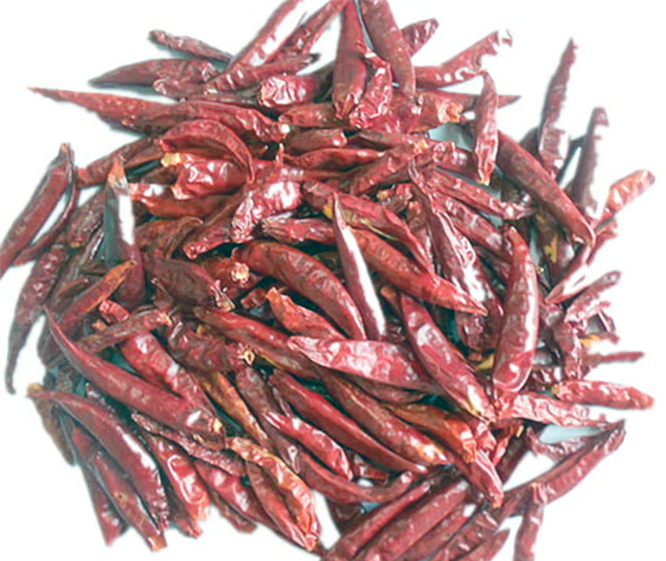 air-dried red chillies against a white background