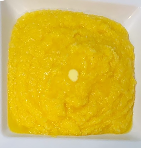 Bahamanian yellow grits in a square bowl