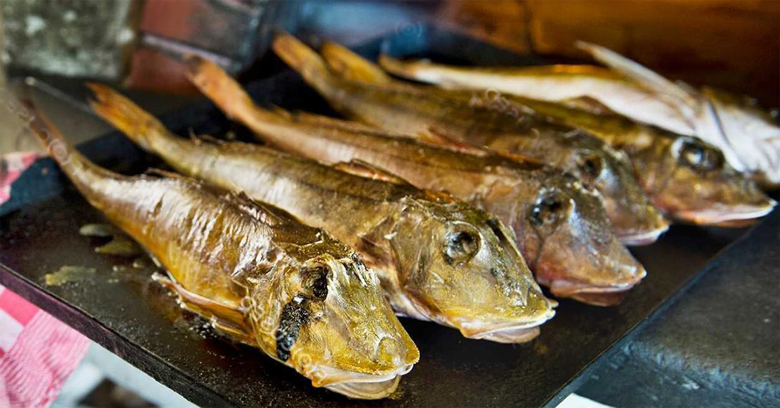 baked stuffed gurnard on a baking tray