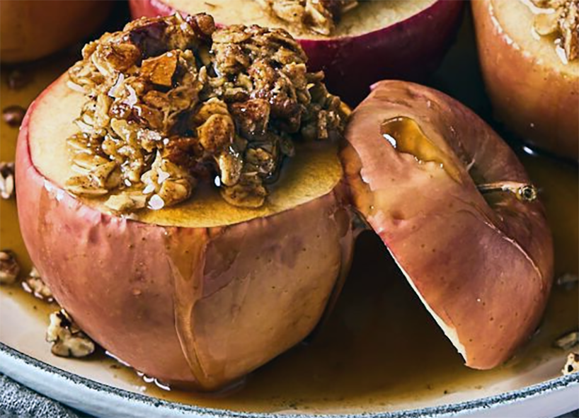 baked apple with muesli stuffing drizzled with honey