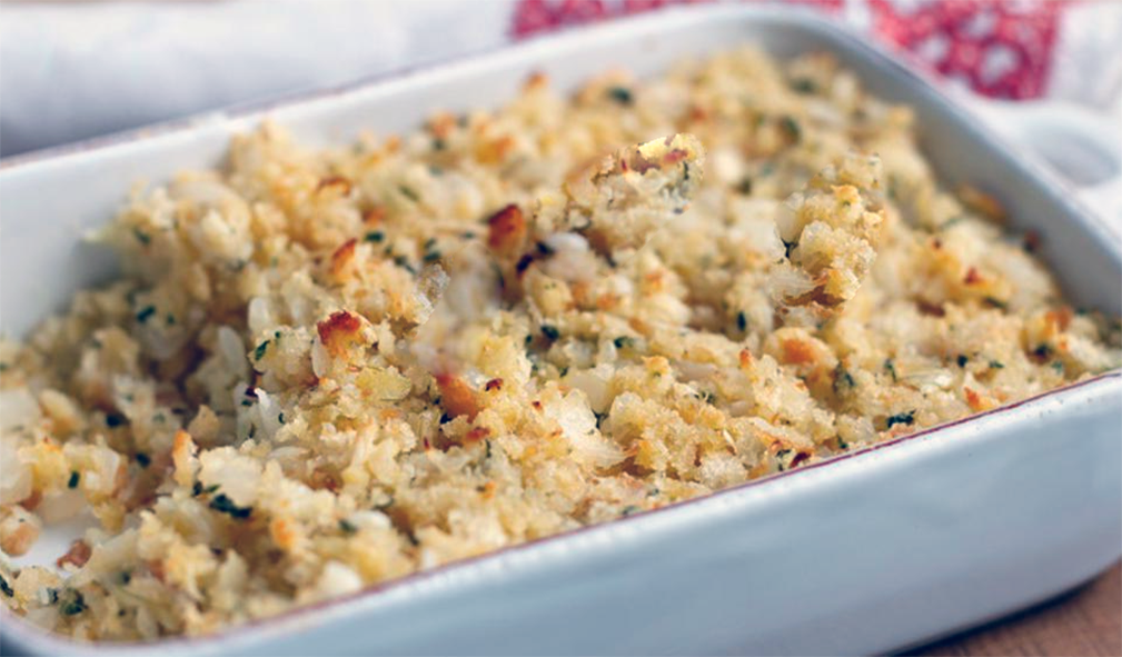 bergamot and onion stuffing in a white baking dish