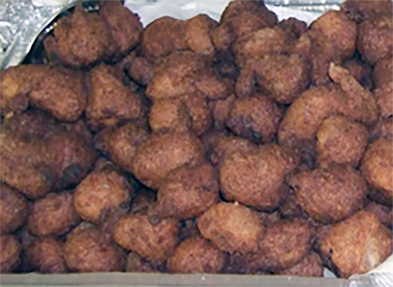 fried binch akara, bean fritters, in an oblong glass dish