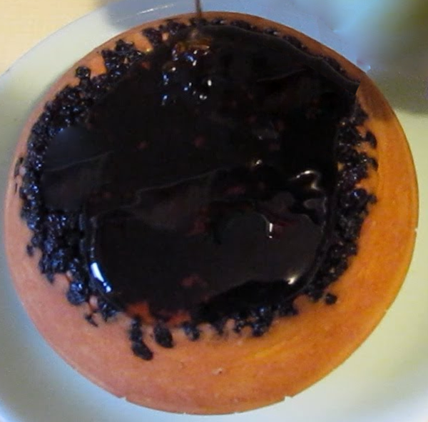 steamed black cap pudding topped with blackcurrant jelly