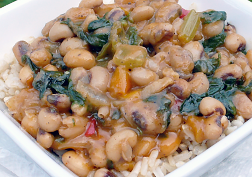 black eyed peas gumbo served in a bowl on a bed of rice