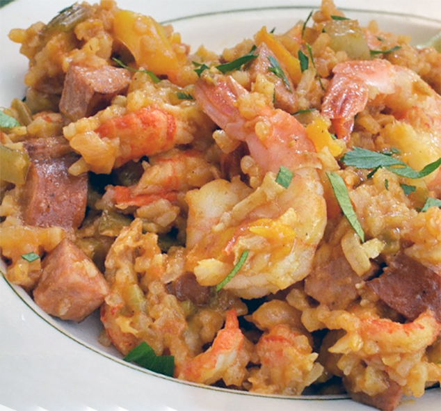 blue bayou jambalaya of rice and prawns served on a plate