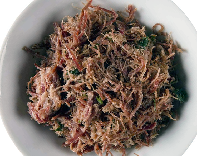 dried and shredded charque in a white bowl