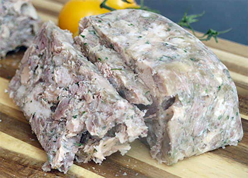 piece of brawn with two slices cut from it