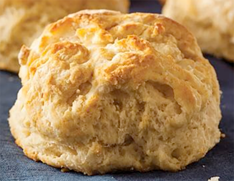 buttermilk baking mix biscuits arranged on a blue cloth