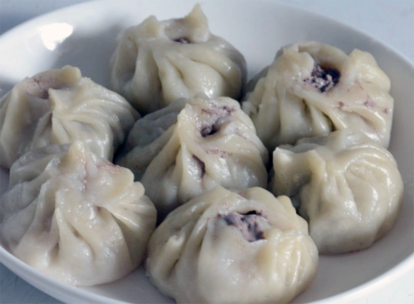 steamed Mongolian Buuz dumplings arranged on a plate