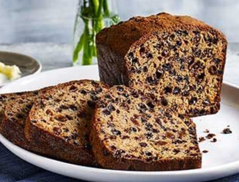 tea loaf with slices in front of the main loaf cate presented on a plate