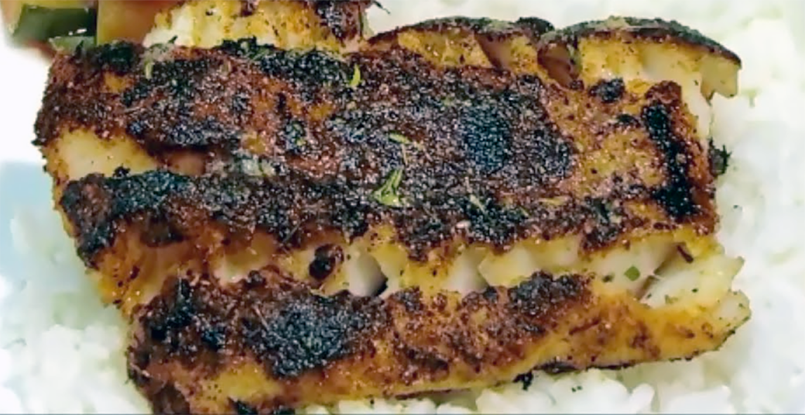 Cajun blackened fish served on a bed of rice