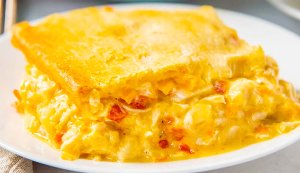 Cajun chicken casserole with buttermilk biscuit topping served on a plate